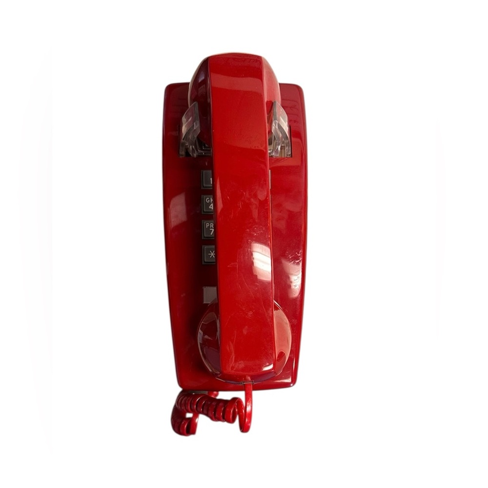 Vintage Cortelco 2554 series wall-mounted analog telephone, in the "Red" color.